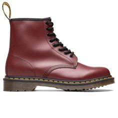 The ideal boot for casual wear and comfort is emulated with Dr. Marten’s 1460 Cherry Red Smooth for men. The complete leather base is accented with a chunky rubber sole. This adds a grunge punk look to what may seem like a normal boot. This piece of footwear has breathable insoles created by Doc’s team. Yellow stitching wraps around the boot - a signature piece to Dr. Martens. Leather fabric Synthetic sole Stitched details All sizes are listed in U.S. Men's sizing unless stated otherwise Style N Punk Looks, Sneaker Stores, Grunge Punk, Street Wear Urban, Cherry Red, Dr. Martens Boots, Leather Fabric, Boutique Clothing, Combat Boots