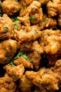 closeup of chicken wings with parsley on top