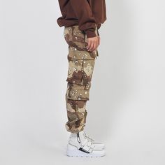 - 100% desert camo print cotton denim- Daniel Patrick branded button front closure with zip fly- Belt loop waist- Utility pockets with velcro closure- Daniel Patrick motorsport rubber label at left thigh- Adjustable bungee cord at ankleSlightly oversized fit. For a more regular fit, we recommend taking one size down.Male model is 6' 1" and wears a size Medium.Female model is 5' 8" and wears a size X-Small.