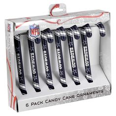 six nfl candy canes in a white box with snowflakes on the side