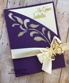 a purple and white card with a butterfly on it