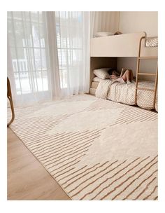 a woman laying on top of a bed in a bedroom next to a bunk bed