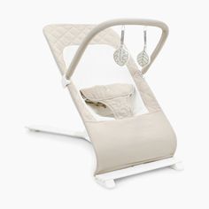 a baby swing that is in the shape of an infant's bed with a white base