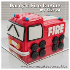 there is a cake shaped like a firetruck on the table and it says, dairy's fire engine diy cake kit