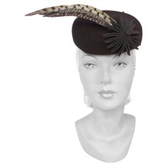 1930s/1940s Brown Fur Felt Sculpted Hat With Feather and Ribbon Accents. This hat is multi-dimensional with its grosgrain flower/tails and its 3 accent feathers.This hat has a back panel to xlant the hat and including the matching hand-made hatpin. Mariah Carey Dress, Hungarian Fashion, 1920s Hats, 1930s Hats, Womens History, Hat With Feather, 1940s Hats, 1940's Fashion, Spain Trip