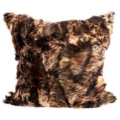 an animal print pillow on a white background