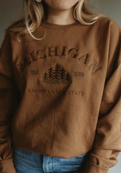 Embroidered Sweatshirt For Everyday Fall Wear, Brown Sweatshirt With Embroidered Logo For Fall, Everyday Tops With Embroidered Text For Fall, Embroidered Text Tops For Everyday Fall Wear, Brown Fall Sweatshirt With Embroidered Logo, Fall Sweatshirt With Embroidered Graphics For Everyday, Embroidered Everyday Sweatshirt For Fall, Everyday Embroidered Sweatshirt For Fall, Brown Crew Neck Top With Embroidered Logo