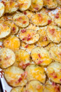 baked potato chips with cheese and bacon on a baking sheet ready to be served in the oven