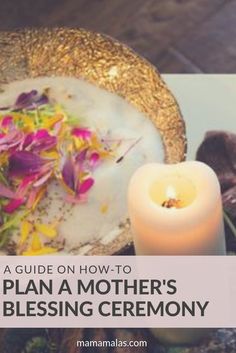 a plate with flowers on it next to a candle