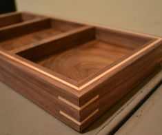 a wooden tray sitting on top of a table