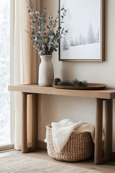 a wooden shelf with a basket and flowers on it next to a window sill