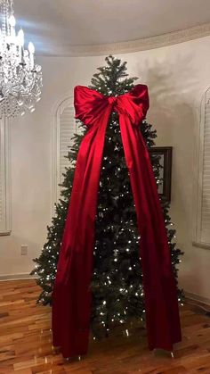 a christmas tree with a red bow on it