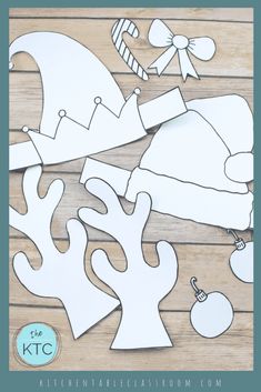 cut out paper christmas decorations on a wooden table