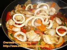 the food is prepared and ready to be cooked in the wok on the stove