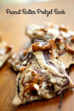 three pieces of peanut butter pretzel bark on top of a wooden table with text overlay