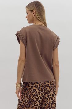 Unleash your inner fashionista with our Brittany Braided Cuff Top! This unique women's top features short sleeves with a playful braided design, making it the perfect layering piece for any outfit. Stand out with this versatile and stylish addition to your wardrobe. Details Round Neck Cap Braided Sleeve Knit 84% Cotton, 16% Polyester Sizing Becca is 5'6" and wearing a size Unique Women Tops, Summer Necessities, Braid Cuffs, Cuffed Top, Long Sleeve Outerwear, Cap Sleeve Top, Romper Dress, Short Sleeved Sweaters, Toddler Fashion