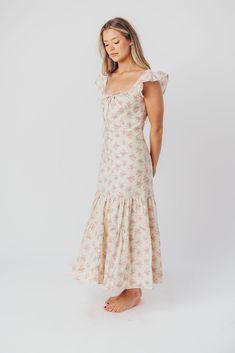 Whether you're frolicking through a field of wildflowers, touring a sunny Greek isle, or attending a springtime baby shower, the Emery Midi Dress will ensure you do it looking like a goddess. We designed this premium dress with an ultra-flattering neckline and a figure-skimming silhouette, paired with a flounced skirt and sweet ruffle details. The Emery is guaranteed to be one of your most feminine (and most favorite!) pieces. FIT: Runs very fitted. This dress is designed with a fit-and-flare profile, and is fitted through the waist and hips. Fabric does not stretch, so we recommend sizing up for more room in the hips MATERIAL: Self: 75% Rayon, 25% Nylon; Lining: 100% Cotton. GARMENT DETAILS: Lightweight summer dress in a long midi length and pastel floral print chiffon. Features a square Flounced Skirt, Field Of Wildflowers, Long Midi, Floral Print Chiffon, A Goddess, Pastel Floral, Style Guide, Midi Length, Fit And Flare