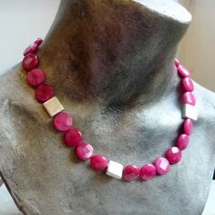 "This rich raspberry colour natural stone necklace. The natural stones are round, flat and faceted. Three square sterling silver beads sit as accents between the string of pink beads. The closure in back is sterling silver plated and very easy to use. A great statement piece for any occasion! Dimensions: Length - 19 \" Approximate diameter of stones: 1.5 cm extender- an extension chain can be added by request *If, for any reason, you are not completely satisfied, please contact me so we can try Pink Stone Necklace, Pink Beaded Necklace, Biwa Pearls, Stones Necklace, Natural Stone Necklace, Square Necklace, Stone Beaded Necklace, Natural Stones Necklace, Jade Necklace