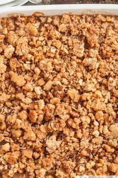 a casserole dish filled with crumbs on top of a table