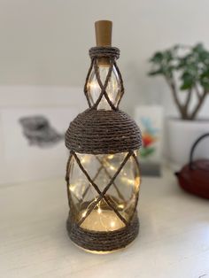 a lighted lantern sitting on top of a table