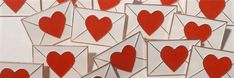 many envelopes with hearts cut out of them