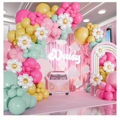 a pink and gold birthday party with balloons, flowers and a vw camper