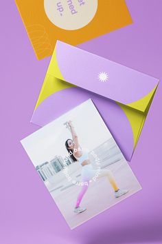 an image of a woman doing yoga in front of a purple and yellow envelope with the words, i am not here on it