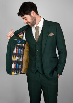 Model wearing full three-piece Caridi while holding open jacket, allowing a look at the inner lining pattern. Blue Tweed Wedding Suits, Mens Tweed Suit, Tweed Wedding Suits, Olive Jacket, Green Tweed, Check Suit, Checked Suit, Brown Tie