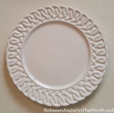 a white plate sitting on top of a table next to a knife and fork,