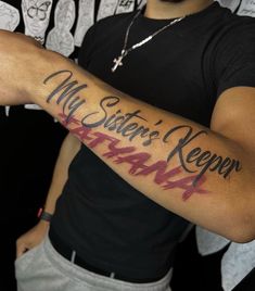 a man with a tattoo on his arm that says, my sister's keeper