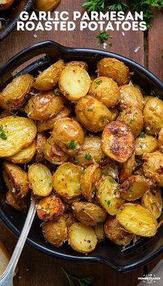 garlic parmesan roasted potatoes in a black bowl