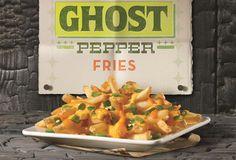 a white plate topped with pasta next to a sign that reads, ghost pepper fries