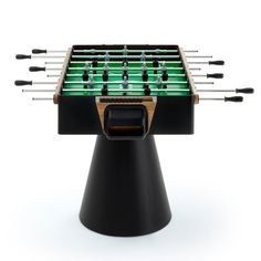 the foosball table is made out of black plastic and has green lights on it