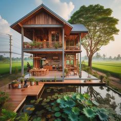 the house is surrounded by water lilies and greenery