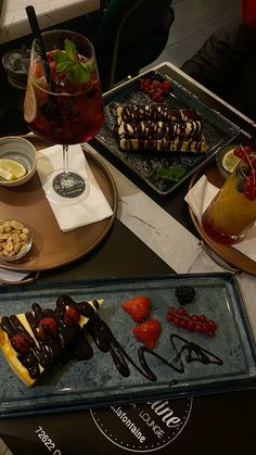 desserts and drinks are sitting on the table