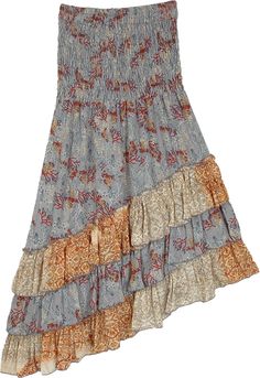 As beautiful as a summer sunny day, this soft flowy floral skirt is a sure mood lifter! With its high low construction, it stands out from the usual- and the pastel colors have a soothing effect for the season.  The skirt has a smocked waist which fits well and looks feminine. #tlb #HighLow #TieredSkirt #Dance #Floral #Printed #CottagecoreTieredSkirt #HighLowSkirt #FloralSkirt #BohemianSkirt Casual Multicolor Flowy Maxi Skirt, Breezy Ruffled Maxi Skirt For Summer, Bohemian Asymmetrical Floral Print Skirt, Breezy Summer Maxi Skirt, Flowy Beach Skirt With Floral Print, Flowy Floral Print Beach Skirt, Flowy Floral Beach Skirt, Breezy Flowy Spring Skirt, Casual Floral Print Asymmetrical Maxi Skirt