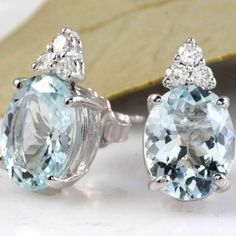 Exquisite 4.25 Carats Natural Aquamarine And Diamond 14k Solid White Gold Stud Earrings Amazing Looking Piece! Estimated Replacement Value: $1600.00 Total Natural Round Cut White Diamonds Weight: Approx. 0.20 Carats (Color G-H / Clarity Si) Total Natural Oval Cut Blue Aquamarines Weight: Approx. 4.05 Carats Aquamarines Measure: 10 X 8mm Earring Measurements Are: 14.46 X 8mm Total Earrings Weight Is: 2.9 Grams Sku #1321 Aquamarine Round Jewelry With Matching Earrings, Luxury Aquamarine Round Cut Jewelry, Luxury Silver Aquamarine Earrings, Elegant Aquamarine Nickel-free Earrings, Blue Aquamarine Nickel-free Earrings, White Gold Earrings Studs, Aquamarine Earrings, Aqua Marine, Aquamarine Blue