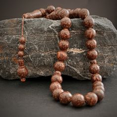 This brown prayer beads is handcrafted. All beads of tasbeeh are made of cinnamon wood. It's rosary a good smelling. You'll feel the mell in your hand as you use it. The known properties of cinnamon tasbeeh are: As a result of the hands touching everywhere throughout the day, a large amount of harmful bacteria can grow on the hand. With these sibha made of cinnamon wood, the bacteria problem is eliminated. Bacteria are destroyed by daily use of tasbih. These scented misbaha beads are a gorgeous Hands Touching, Rosary Prayer, Wooden Gift Boxes, Wooden Gifts, Prayer Beads, Rosary, Bead Charms, Cinnamon, Accessory Gift