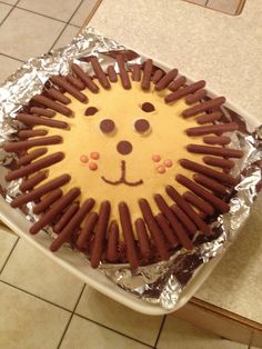 there is a cake decorated to look like a lion