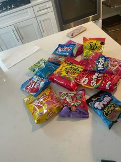 a pile of candy sitting on top of a kitchen counter