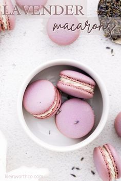 pink macaroons in a white bowl with lavender tea on the side and text overlay that reads lavender macaroons