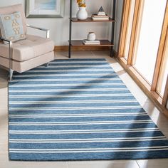 a blue and white striped rug in a living room