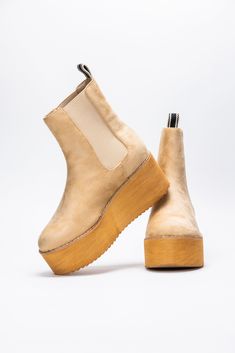 Introducing the Yoshi Boot from Shu Shop! Featuring a faux suede upper and elastic side panels for a comfortable fit, with a back pull tab for easy on and off. The faux wood platform adds a touch of style to any outfit. Step out in these playful boots today! Heel Height: 2.5" Platform Height: 1.75 All Man Made Materials True To Size Footwear is shipped without the original box. If you would like the original box, we can include it for an additional charge. Please contact our customer service tea Shoe Lover, Faux Wood, Side Panels, Color Khaki, Pull Tab, Panel Siding, Faux Suede, Original Box, Heel Height