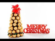 a christmas tree made out of chocolates next to the word merry christmas