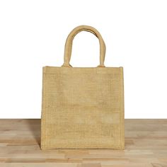 "This reusable heavy duty 100% natural jute shopping tote bags are made to last years of use with reinforced stitching at the stress points for maximum durability. With soft cotton over-the-shoulder web handles long enough to go over your shoulder, this durable tote can hold heavy groceries. It's perfect for carrying around town while you're running errands. This biodegradable, extremely durable burlap shopping bags are ideal for wedding welcome bridesmaid bag, shopping, work, school, beach or p Cheap Jute Beach Bag For Travel, Natural Tote Bag For Grocery, Beige Reusable Rectangular Bag, Eco-friendly Rectangular Reusable Canvas Bag, Eco-friendly Rectangular Reusable Lunch Bag, Reusable Rectangular Canvas Bag, Rectangular Reusable Canvas Bag, Eco-friendly Rectangular Bag With Reinforced Handles, Eco-friendly Natural Bags With Reinforced Handles