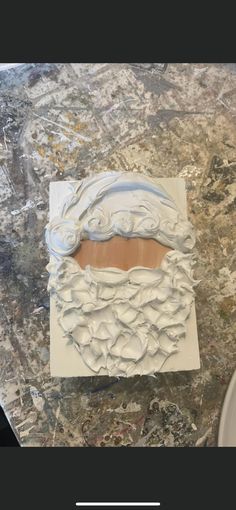 a cake that has been made to look like santa's face on top of it