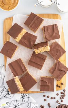 chocolate peanut butter bars cut into squares on a cutting board