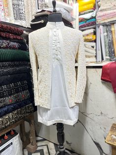 *3 Piece  White ,  Kurta, Pant, and Jacket  *Fabric: %100 Georgette, Satin, Thick, Warm, Comfortable, Breathable, Softer, Satin Feeling *Center Open  Jacket ,  With Zipper Fly Pants. *This Suit Has A 6" Drop Which Is The Difference Between The Size Of The Sherwani & Pants. For Example, A 40r Jacket Includes A 34W Pant *Dry Clean Only Important Note: All Our Products Are Made To Order ! Please Contact Us For Perfect Fitting Suit. .Full Lining Shrugs With Padding *We are proud to offer a wide rang Off White Zari Work Sets For Formal Occasions, Off White Formal Sets With Zari Work, Formal Off-white Sets With Zari Work, Festive Fitted Beige Set, Cream Fitted Long Sleeve Nehru Jacket, Festive Beige Fitted Sets, White Fitted Bandhgala For Festive Occasions, Formal Fitted White Traditional Wear, Cream Festive Sets With Dabka Details