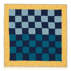 a blue and yellow quilt with squares on it