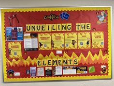 a bulletin board with the words unveiling the elements written in yellow and red